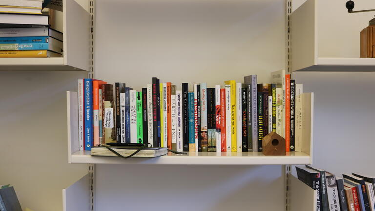 A banner image of a full bookshelf