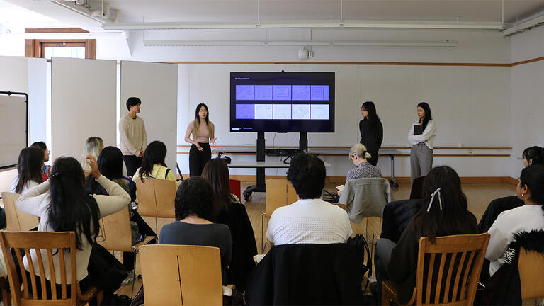 Students giving a presentation in MMCH 203