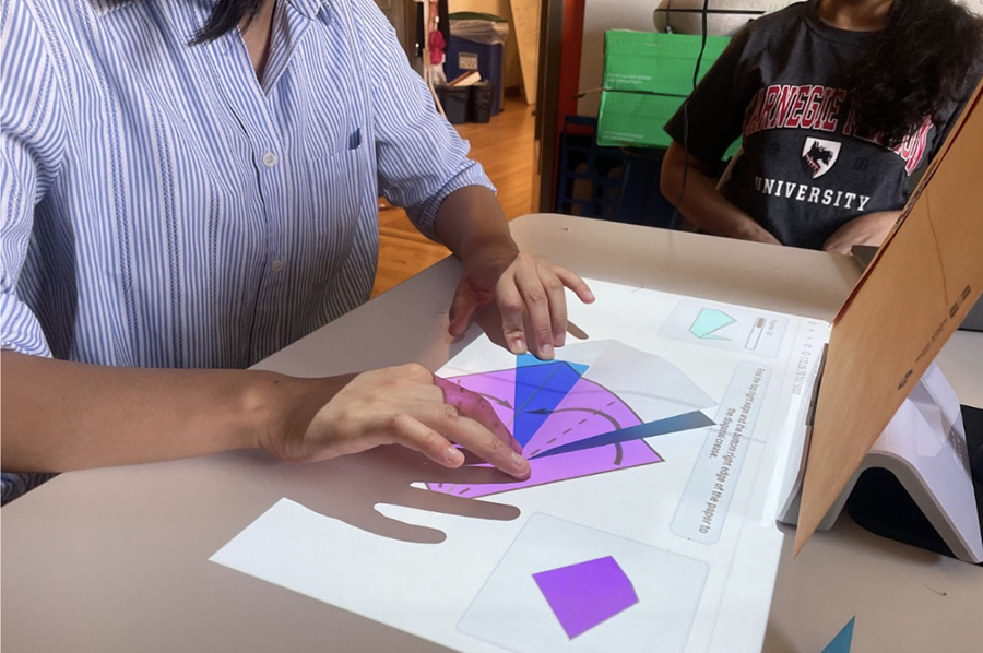 A mixed reality app teaching a user how to fold origami