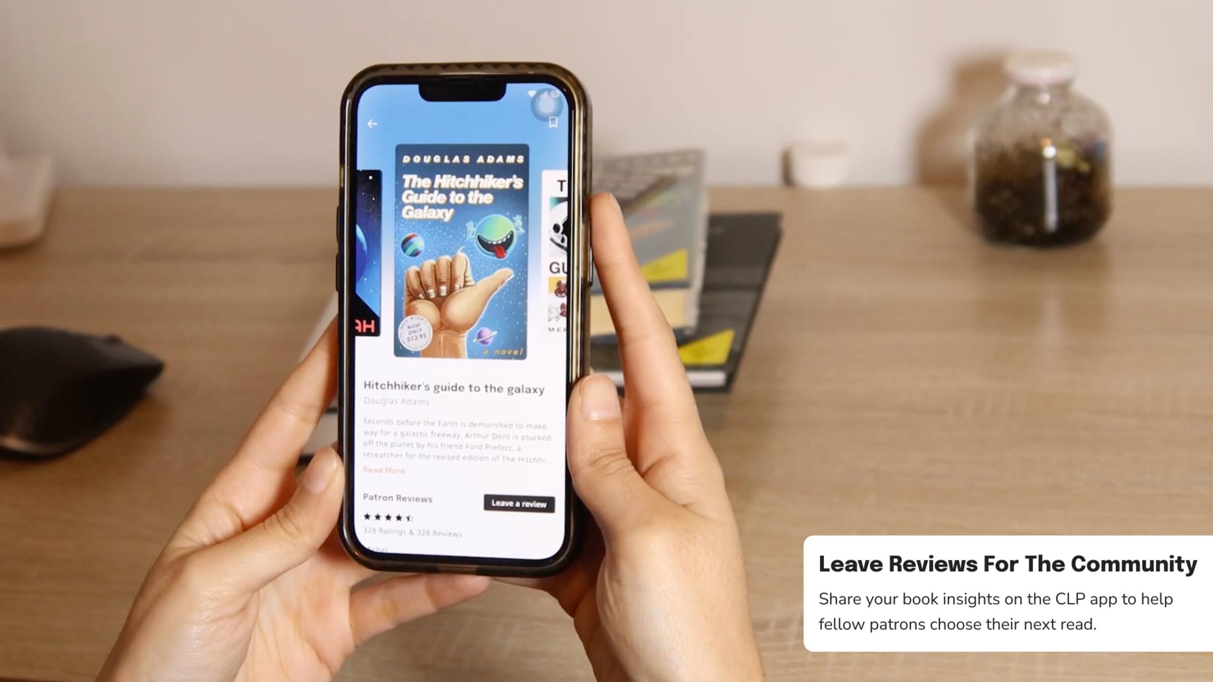A person leaving a review for a book on their phone
