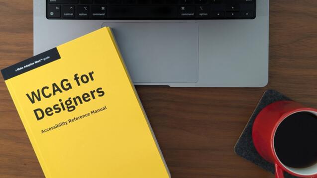 A copy of WCAG for Designers on a laptop