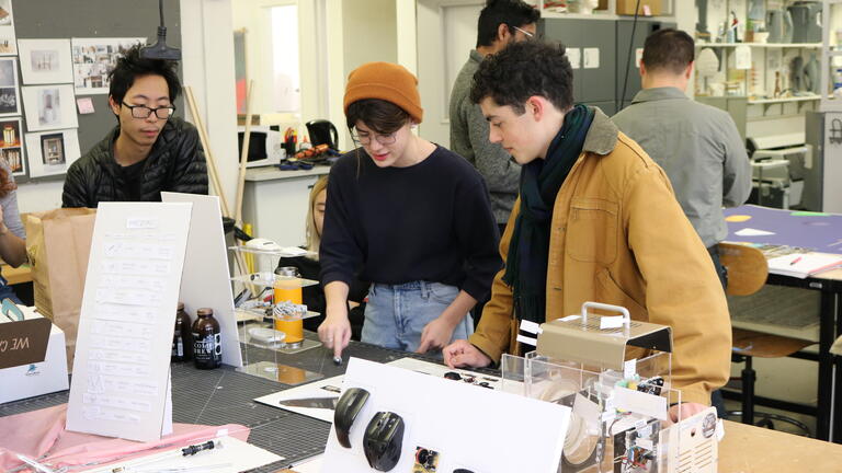 Products students looking at work in Porter Hall