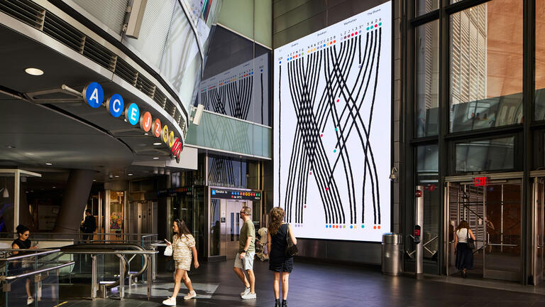People walking through the Fulton Center