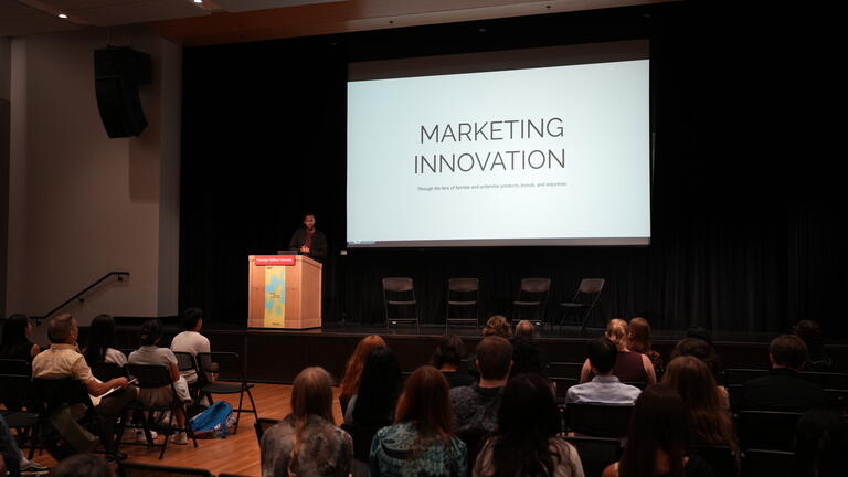 Nick Robinson speaking at the Nexus Design Symposium