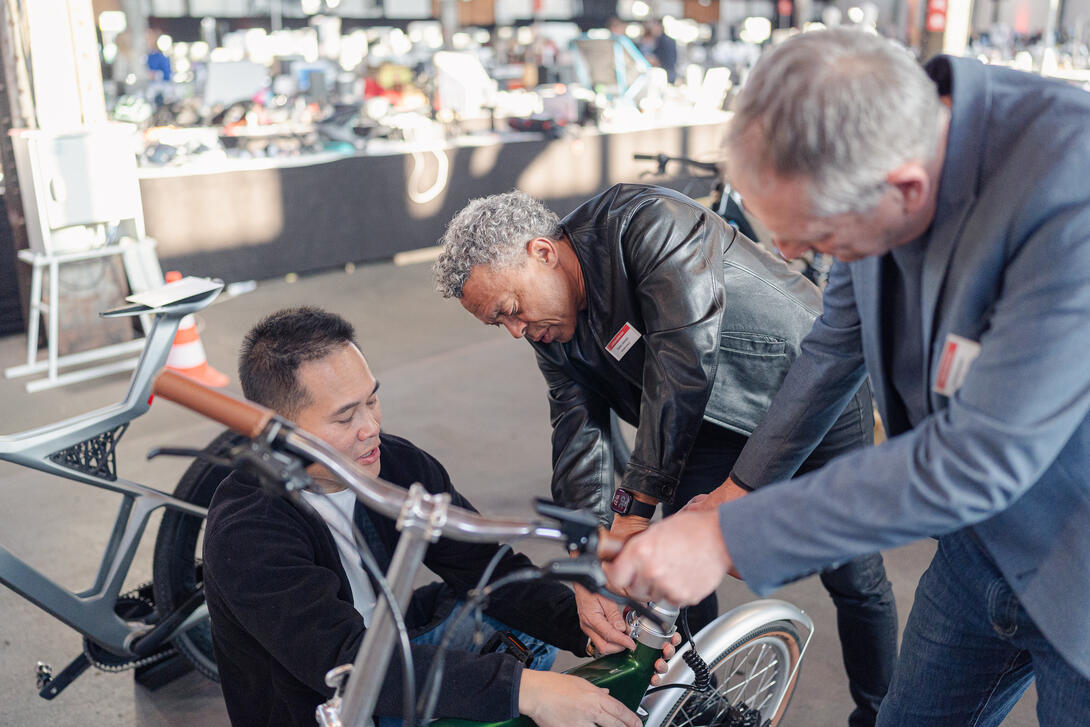 Charles Johnson looking at a bike