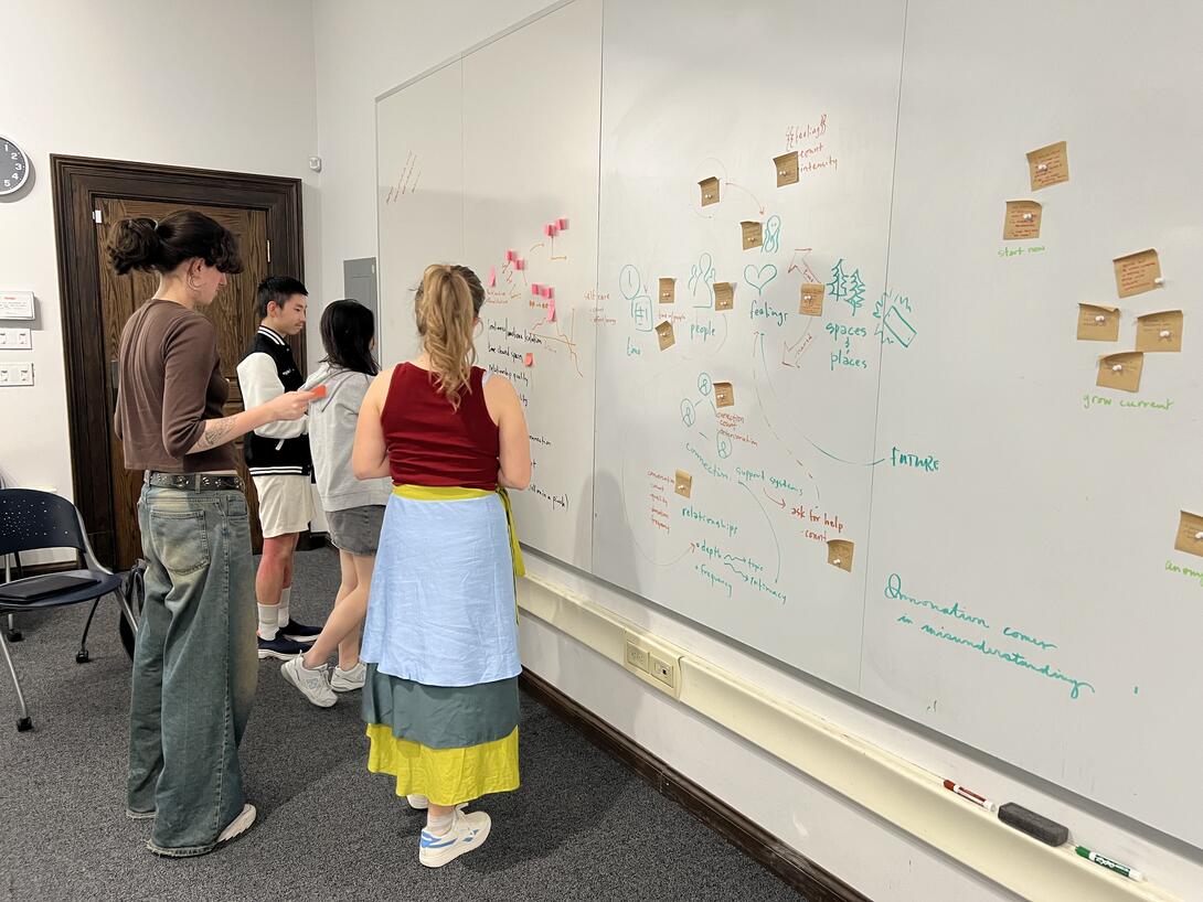 Students working at a whiteboard